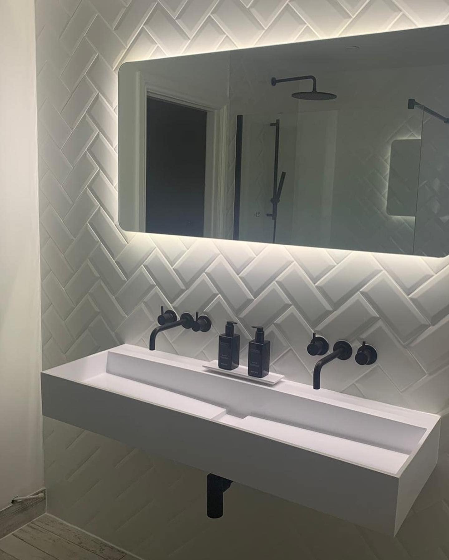 Herringbone Tile Finish and Underfloor Heating Bathrooms by LV